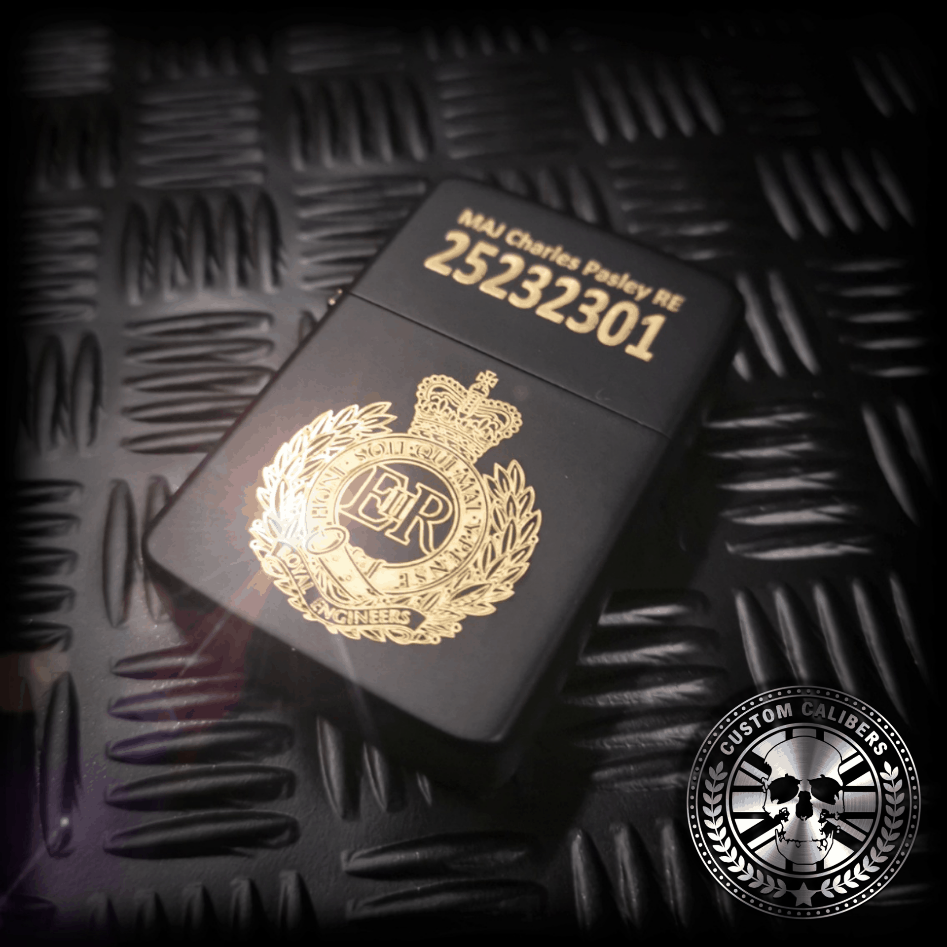 a side shot of a matt black engraved lighter