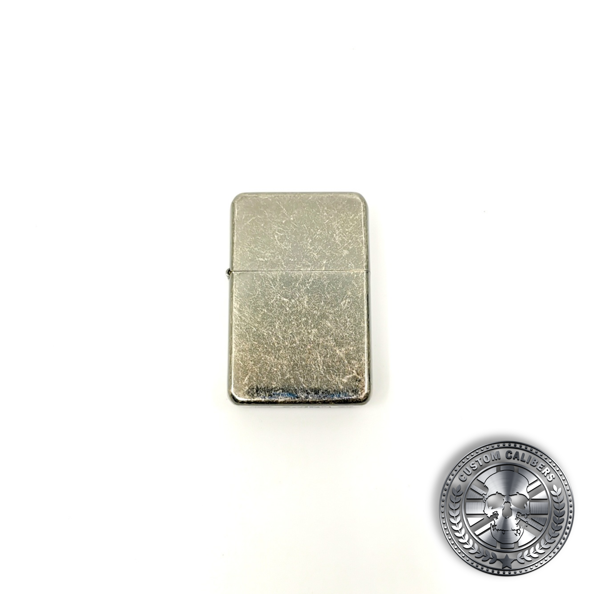 a great shot of an antique steel effect flip top oil lighter