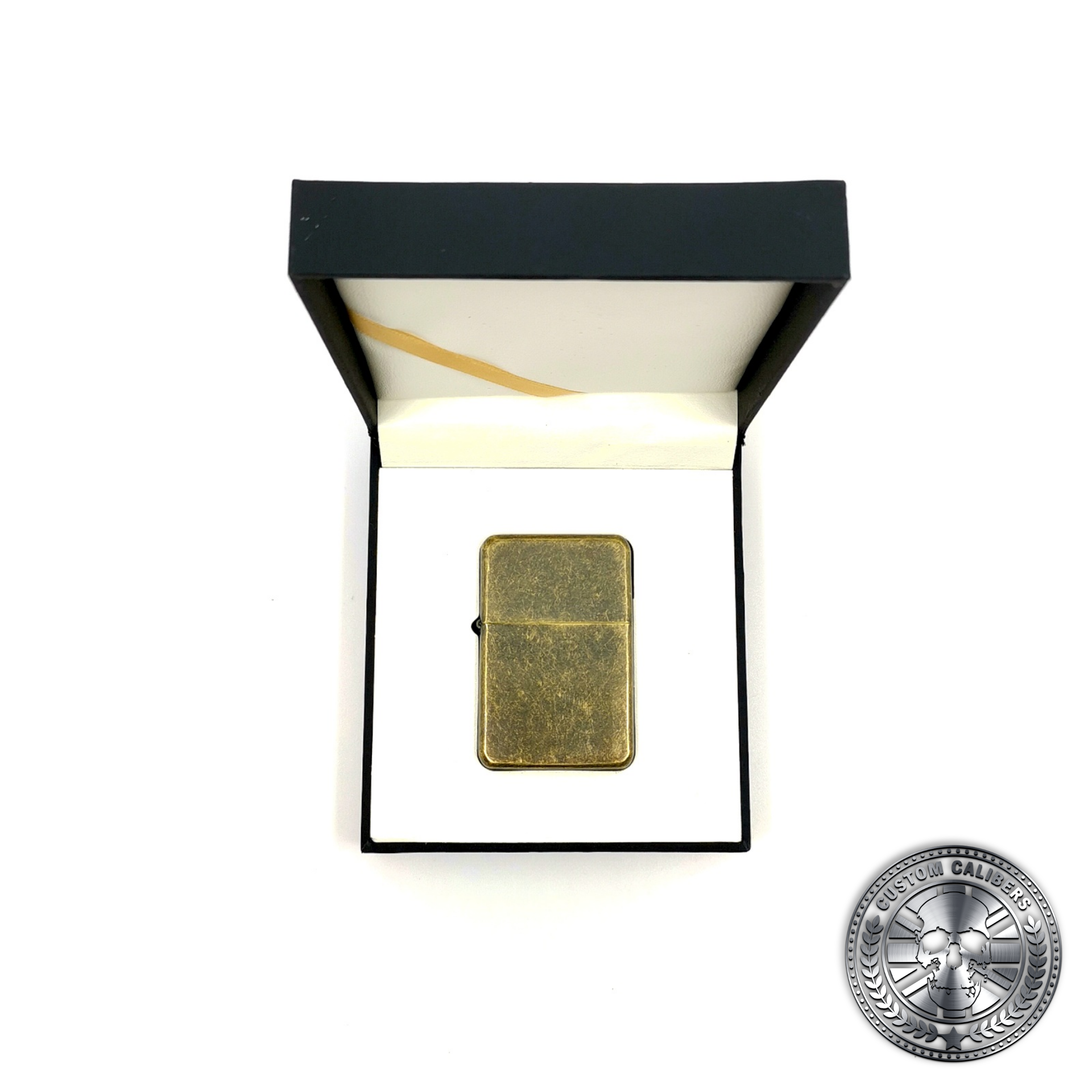a photo of an antique brass effect flip top oil lighter in a luxury gift box