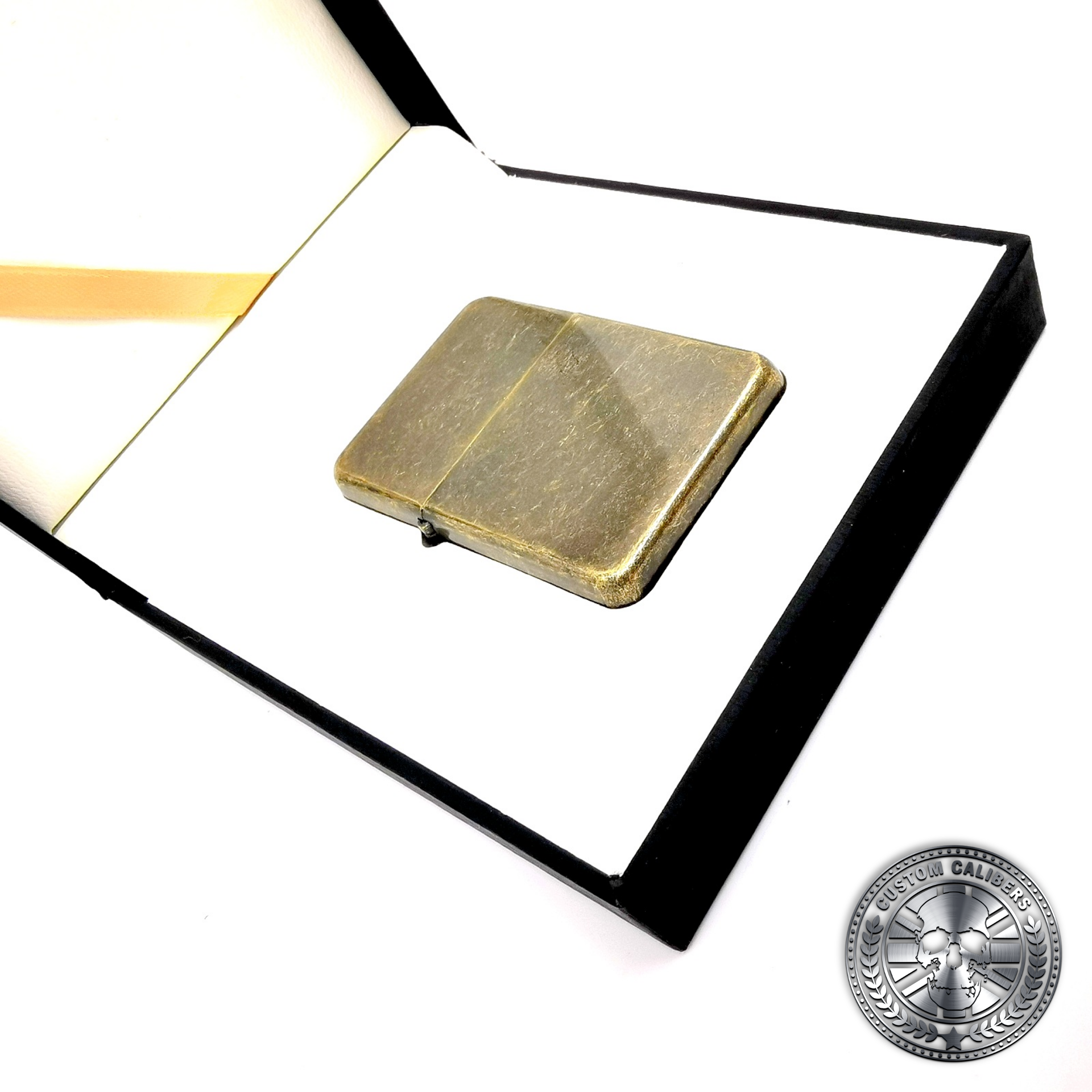 another photo of an antique brass effect flip top oil lighter in a luxury gift box