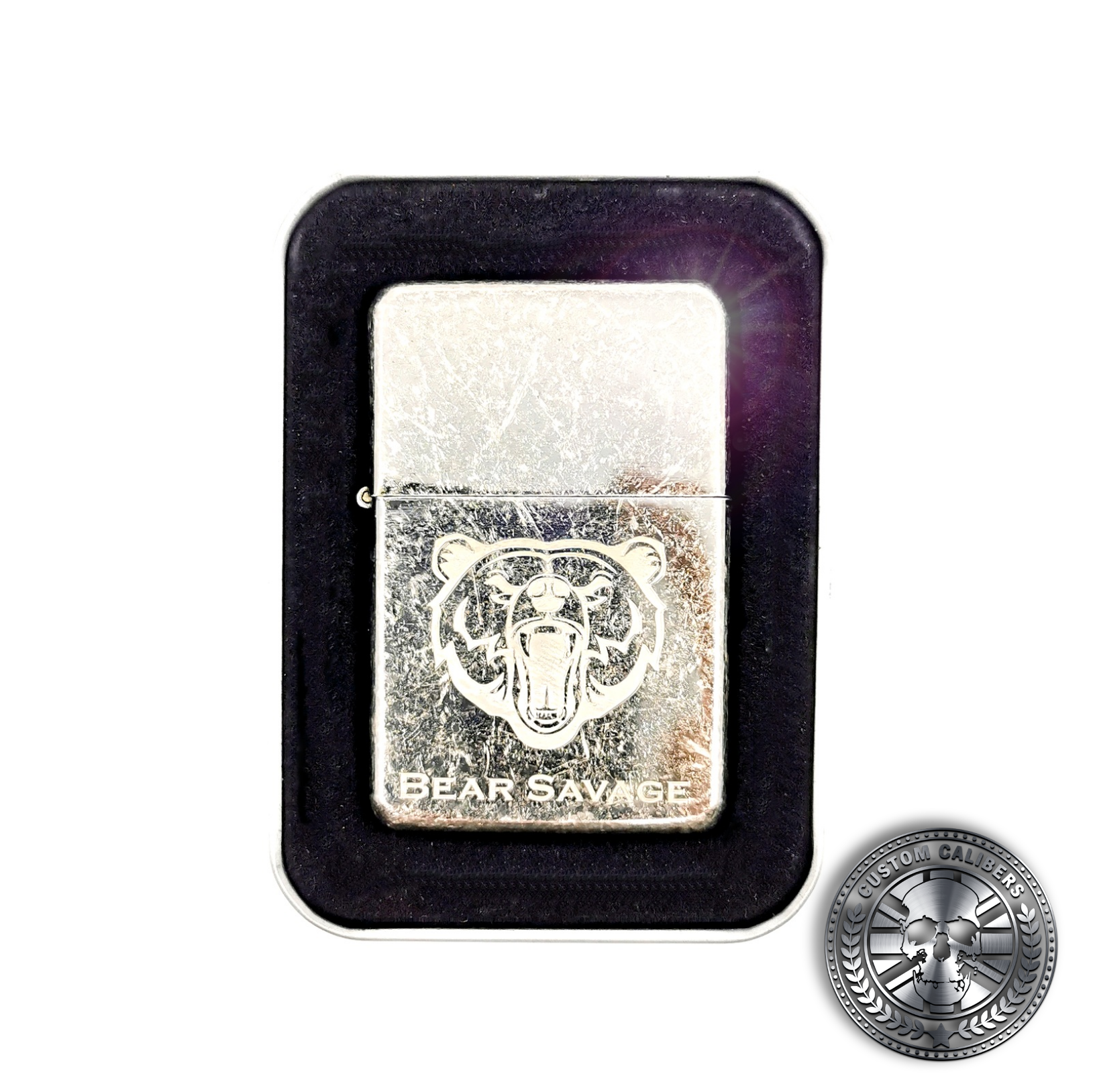a close up of an antique effect steel flip top oil lighter with engraved logo laser engraved