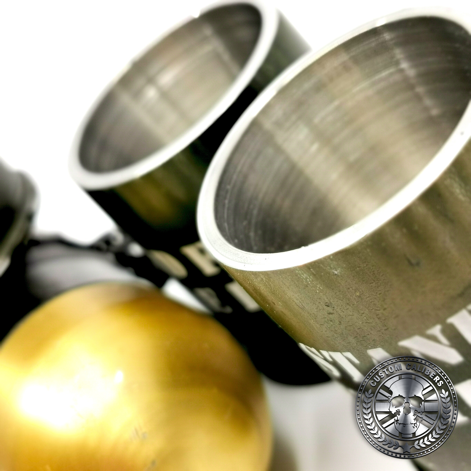 a close up of the famous 40mm GMG grenade shot glass showing the rim of the shot glass