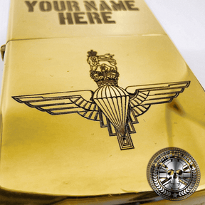 another great close up shot of a polished solid brass flip top lighter engraved with the parachute regiments logo on the front