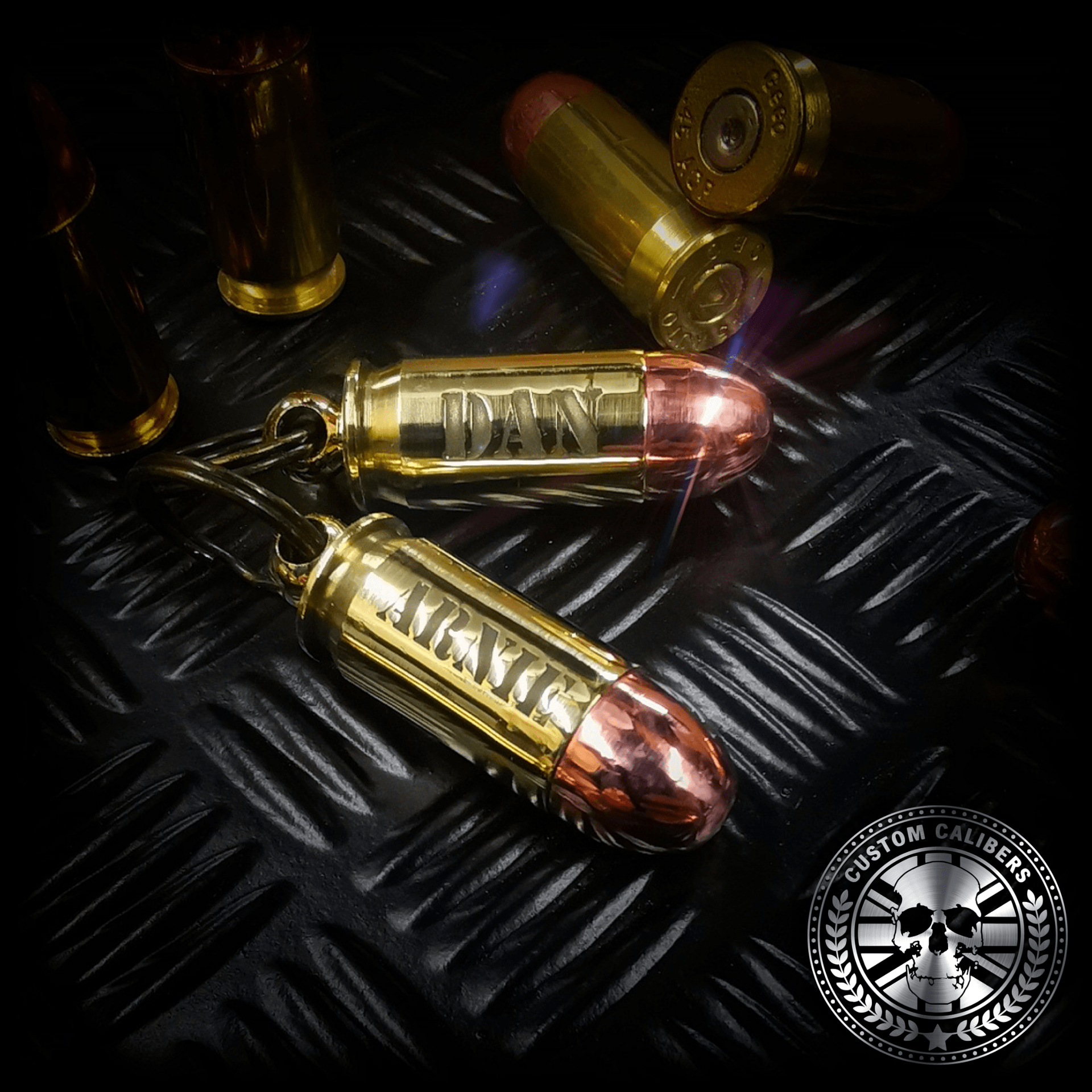 aprofessionalphotooftwoofour.ACPbulletkeyringsengravedwithindividualnames