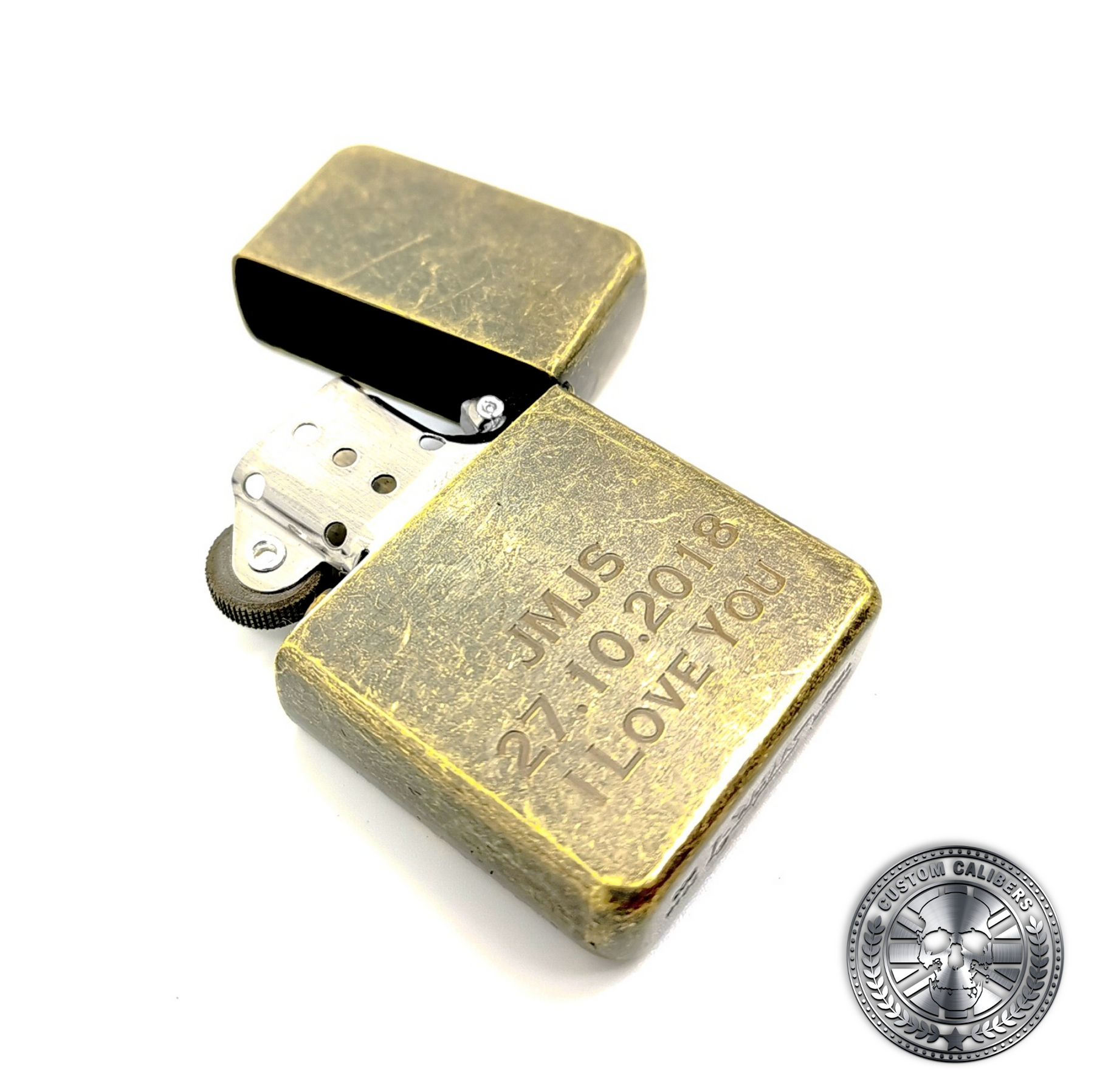 a photo of an antique brass effect flip top oil lighter