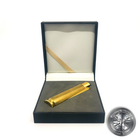 a photo of a real .50 caliber bullet lighter lighter in a luxury gift box made by custom calibers