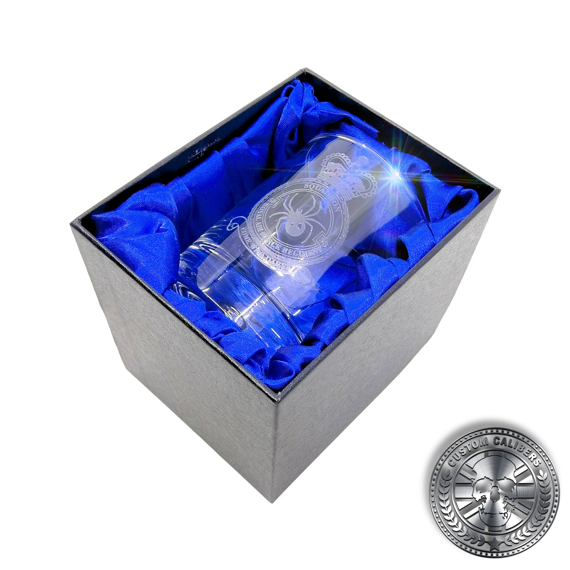 a laser etched whisky tumbler inside a silk lined gift box
