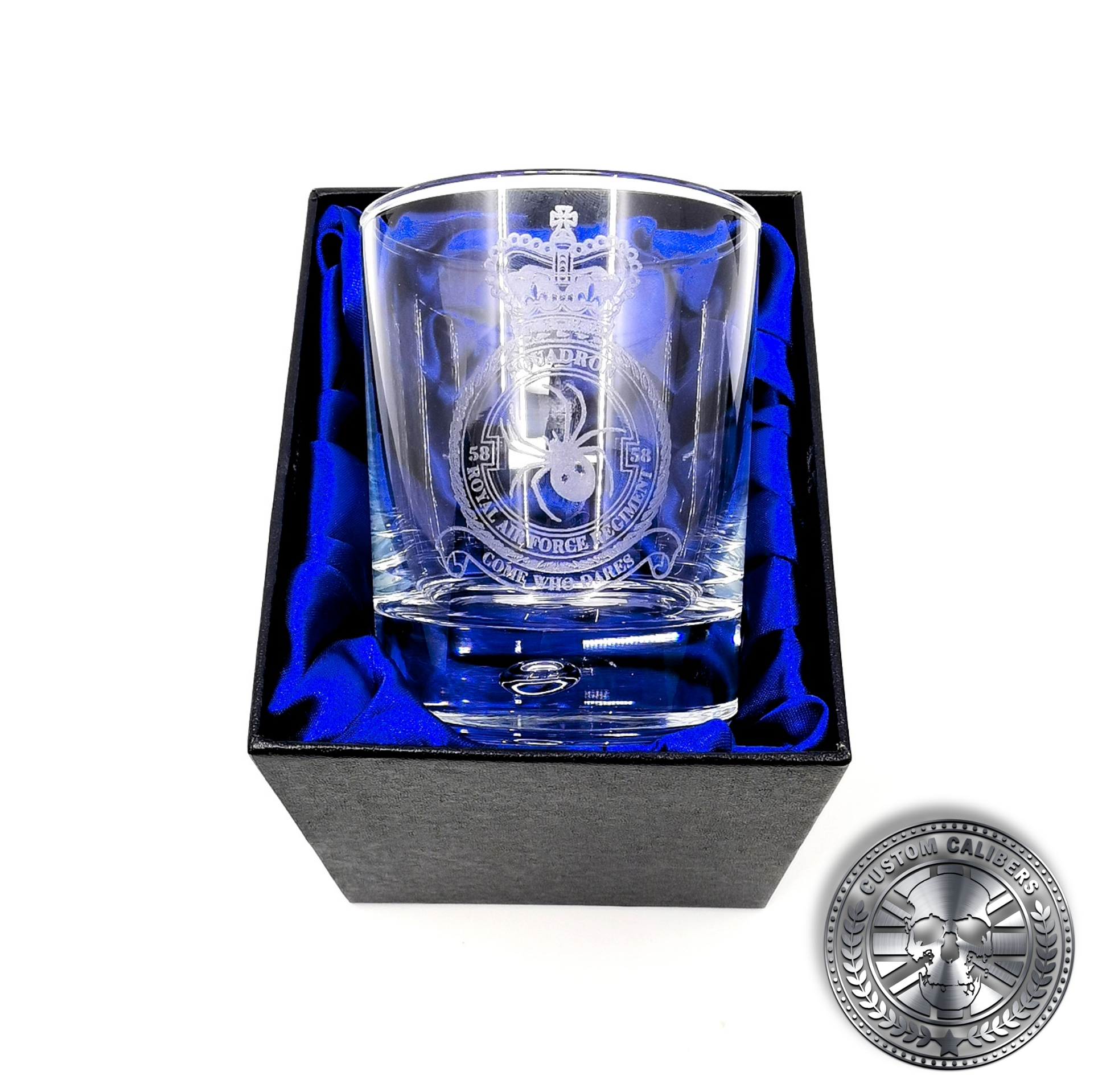 a close up photo of a laser etched whisky tumbler inside a silk lined gift box