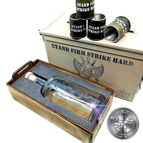 a desert tan ammo tin gift box showing off an engraved bottle and four 40mm GMG shot glasses