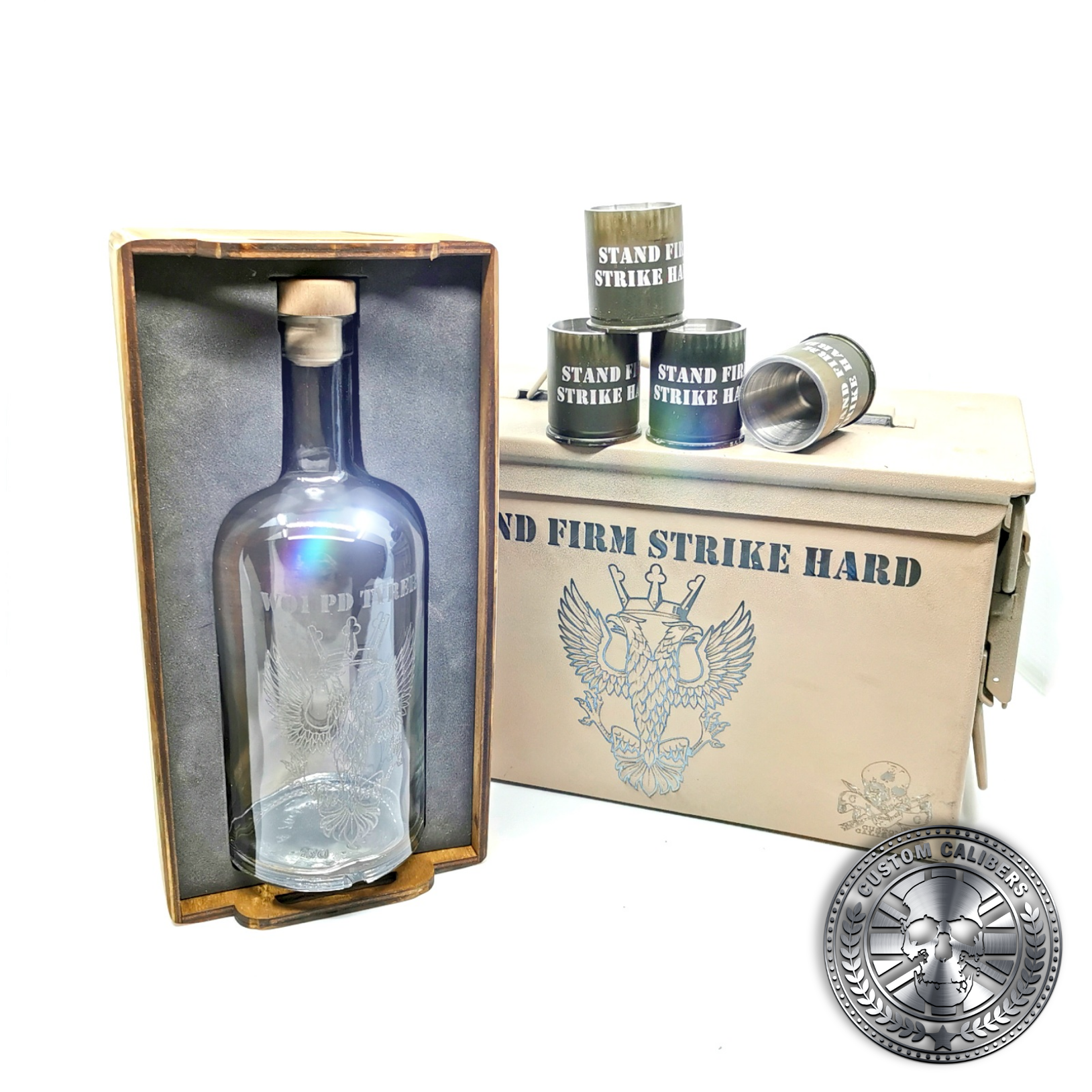 another great photo of a desert tan ammo tin gift box showing off an engraved bottle and four 40mm GMG shot glasses