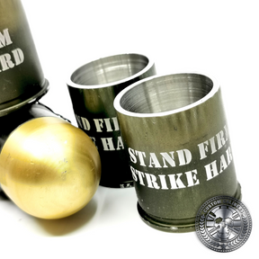 a great shot of several 40mm GMg grenade shot glasses made from real once fired cases