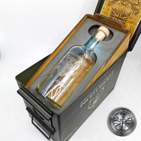 an engraved whisky bottle sitting inside an ammo tin gift set