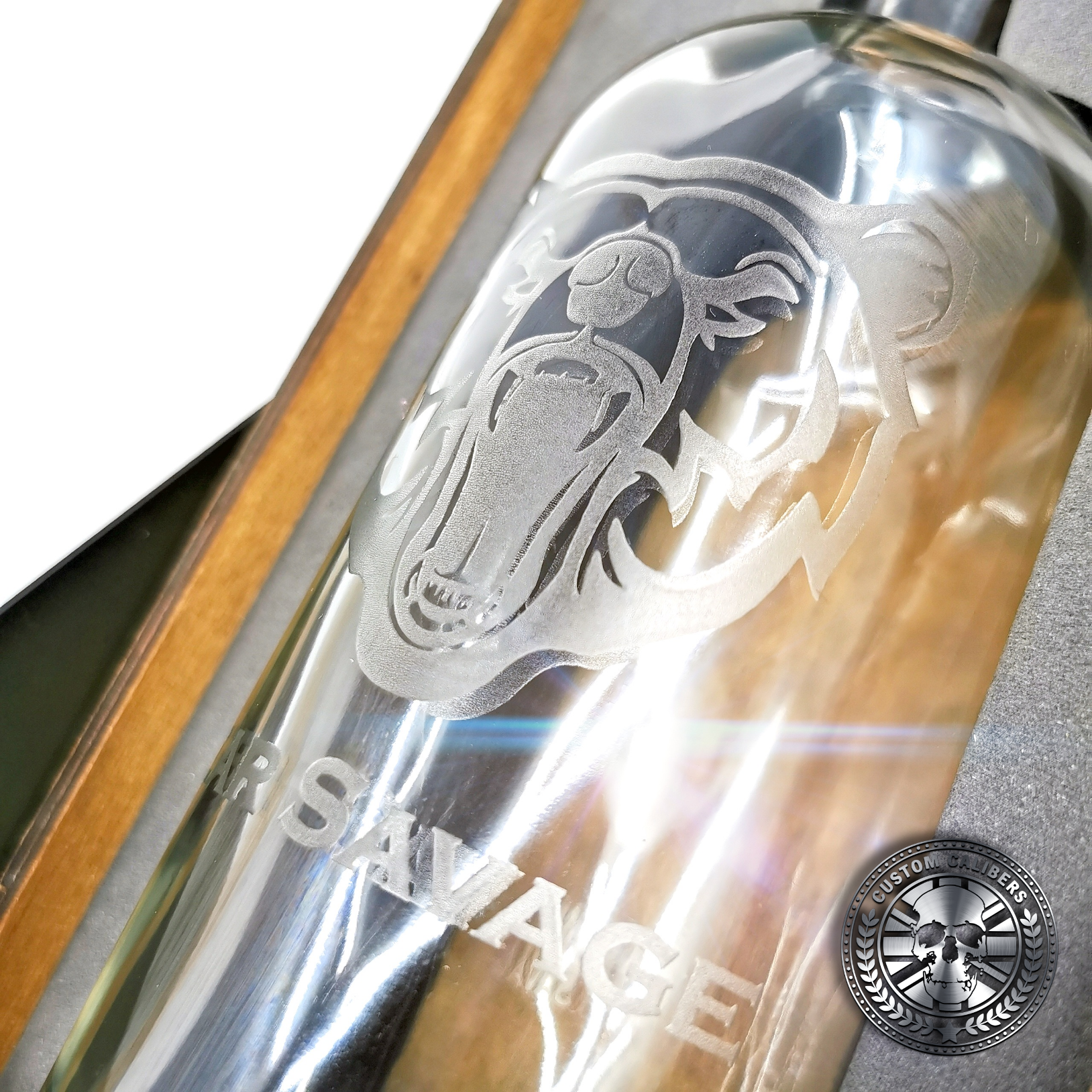 a close up of an engraved whisky bottle gift set